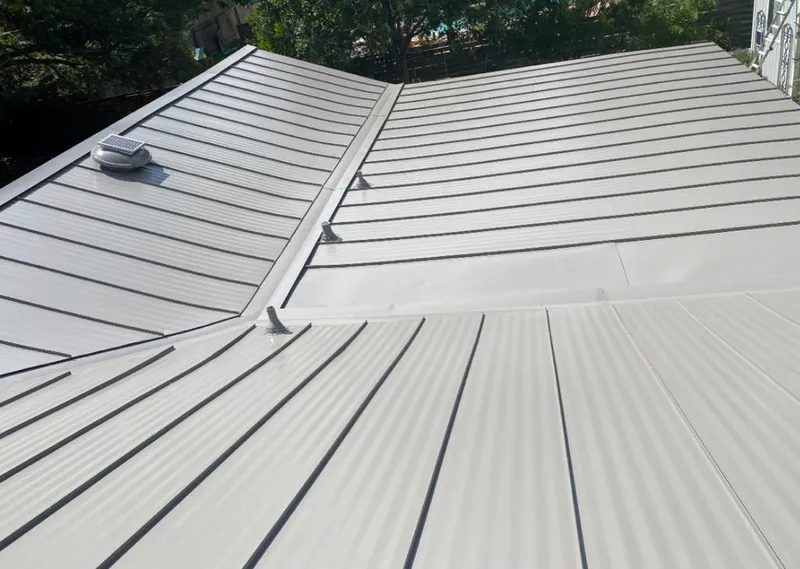Solar attic fan installed on a metal roof for Roof Ventilation in North Miami Beach